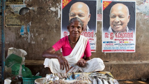 Keralite woman selling fresh fish in Fort Cochin market, Kerala.