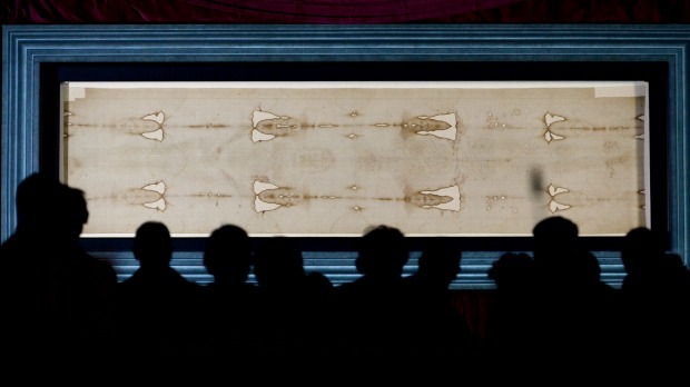 The Holy Shroud, the 14 foot-long linen revered by some as the burial cloth of Jesus, on display at the Cathedral of ...