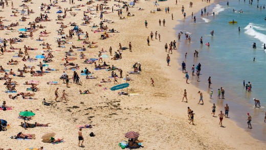 Summer crowds on the sands of Bondi Beach.