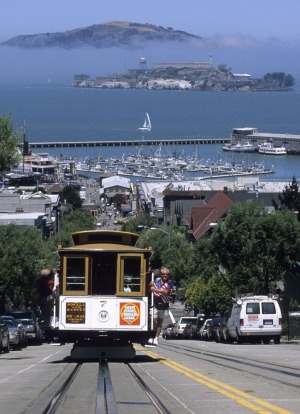 San Francisco's cable car with Alcatraz beyond.