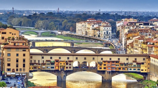Bridges over the Arno River at sunset in Florence, Italy.