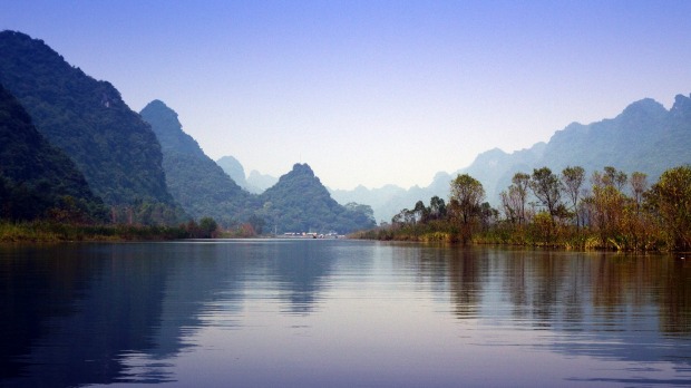 Enjoy a dragon boat ride along the Perfume Pagoda.