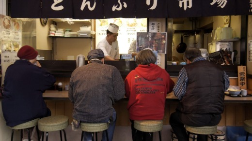 A morning food stall near Tsukiji Fish Market.