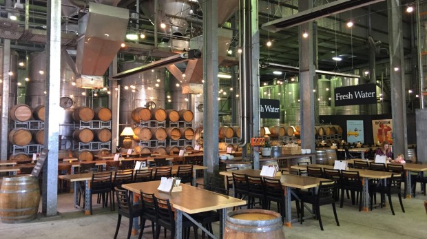 At Mt Duneed Estate, the Barrel Hall dining area is an impressive lofty industrial space, with huge steel vats suspended ...