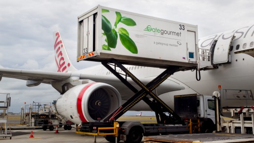 Gate Gourmet Food Production trucks delivering food to Virgin Airlines.