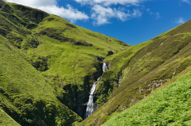 Waterfall in Moffat Valley, Moffat, Dumfriesshire, Scotland.  Grey Mare’s Tail Nature Reserve is fantastic for walking ...