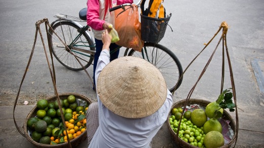 A street vendor sells fruit in Ho Chi Minh City.