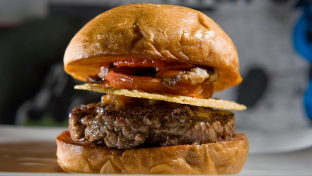 The signature burger at Umami Burger in Costa Mesa is the Umami burger which includes ground beef, shiitake mushroom, ...
