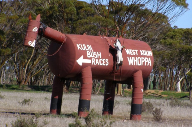 Tin Horse Highway. No missing this sign pointing the way to the racecourse near the wheatfields town of Kulin in ...