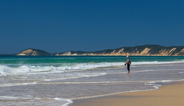 Wetting a line on Rainbow Beach.