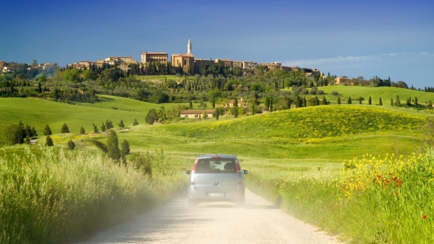 Spend a night in a Tuscany villa and absorb the beauty: A winding road leading to the town of Pienza in Tuscany.