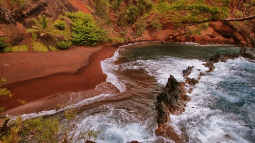 A red sand beach at Kaihalulu, east Maui, Hawaii Red.