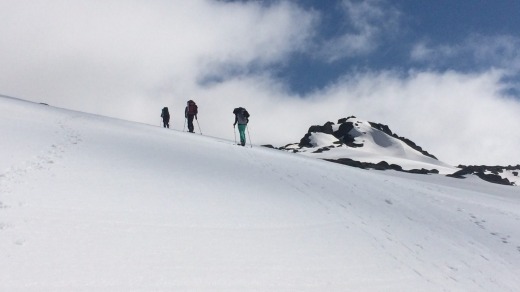 It's not easy going, cross-country skiing uphill in ski boots and wearing heavy backpacks.