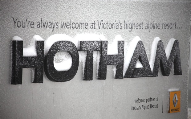 Snowfall covers the sign at Hotham. A further 3cm is expected to fall this weekend.