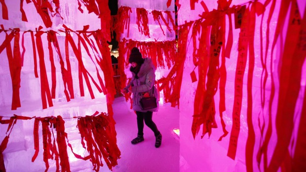People visiting the China Ice and Snow World on the eve of the opening ceremony of the Harbin International Ice and Snow ...