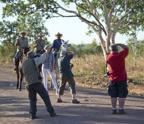 Photographic group taking photos of model, Belinda.