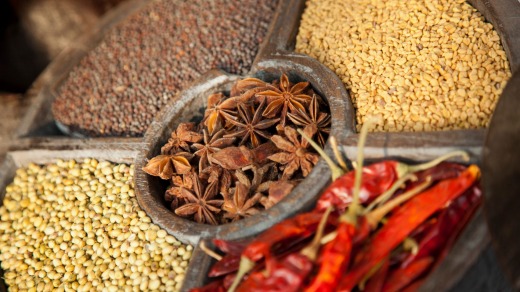 Spices for sale in Cochin, Kerala, presented in a traditional timber spice wheel.