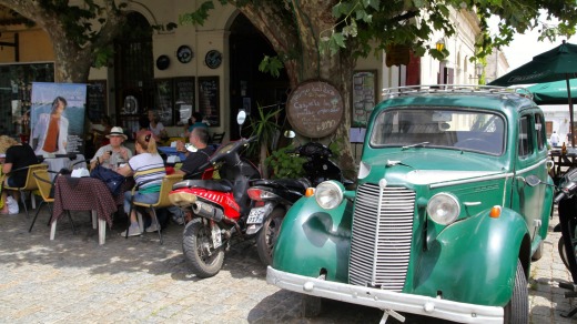 Colonia's quirky El Drugstore cafe, where vintage cars have been parked outside and remodelled into seating booths.