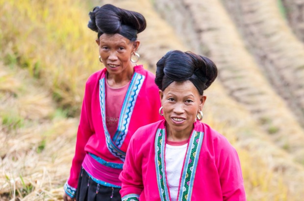 Two yao ethnic minority women on rice terrace Women from the Yao minority.