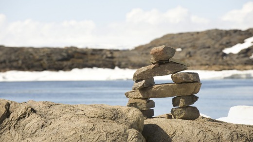 Baffin Island: An inuksuk, a stone landmark or cairn built and used by the Inuit.