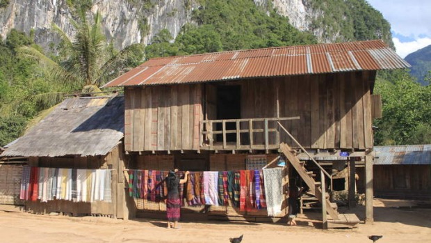 Village life: Ban Sopjam, population 200, nestles under limestone cliffs in northern Laos.