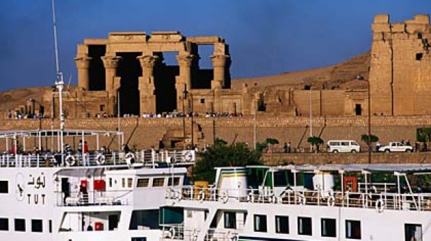 Age of contrasts ...  a cruise ship passes the ruins of Kom Ombo.