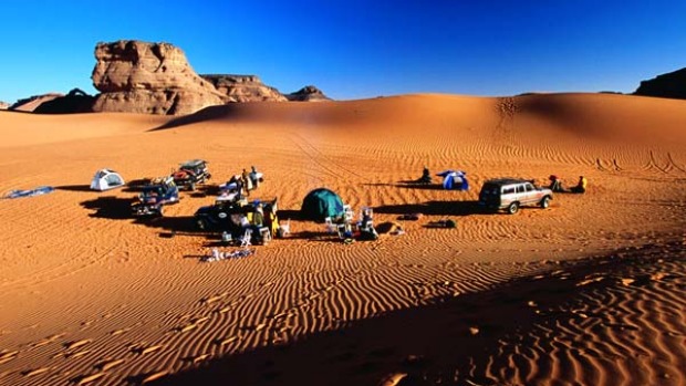 Over the edge ... trucks filled with travellers having their African adventures together can be fun.