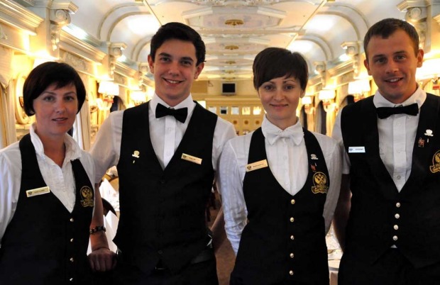 Service staff on the Golden Eagle luxury train.