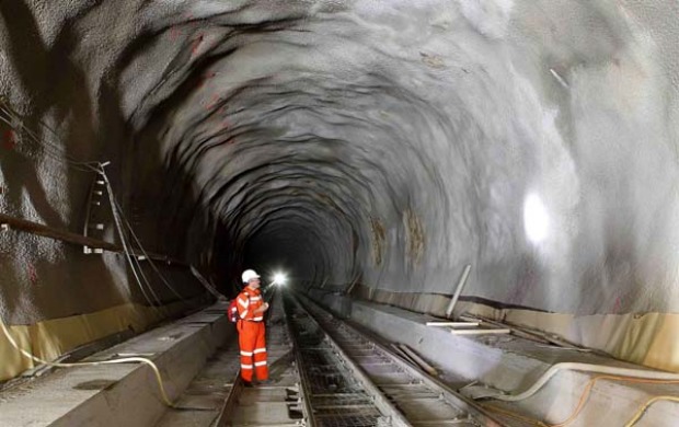 THE LONGEST RAILWAY TUNNEL IN THE WORLD: A worker stands at the construction site of the NEAT Gotthard Base Tunnel.