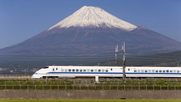 Thrilling ... a bullet train passes Mount Fuji, "that perfect volcano".