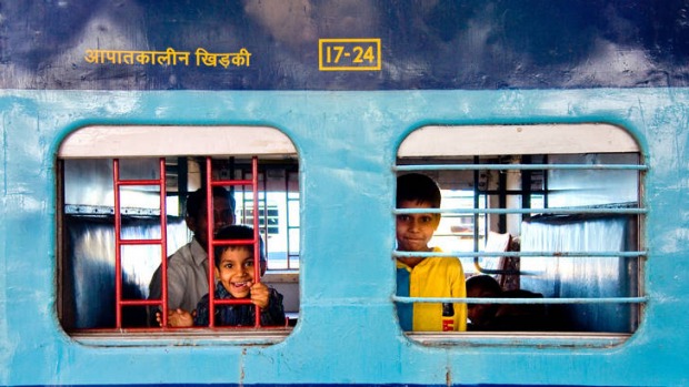 Children ride the rails.