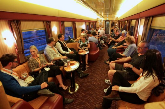 Guests enjoy a few drinks in the bar car on the Indian Pacific.