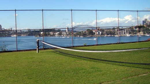 A tennis court with a very different view on Cockatoo Island.