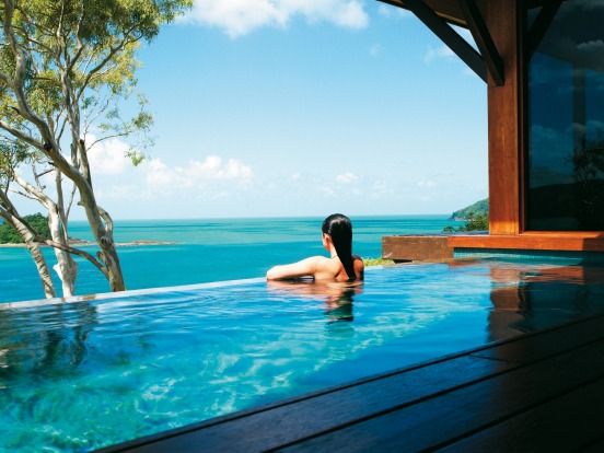 Bed with a view at a Windward Pavilion at Qualia.