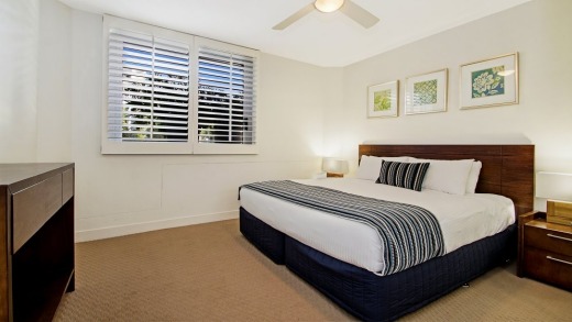 A bedroom at Fairshore Beachfront Apartments at Noosa.