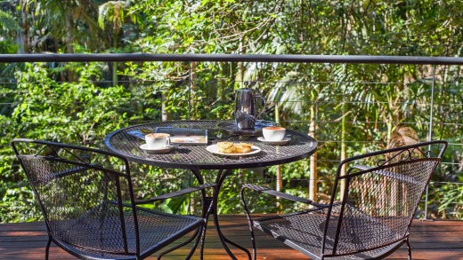 The large timber deck looking over the rainforest is a beautiful setting for some breakfast.