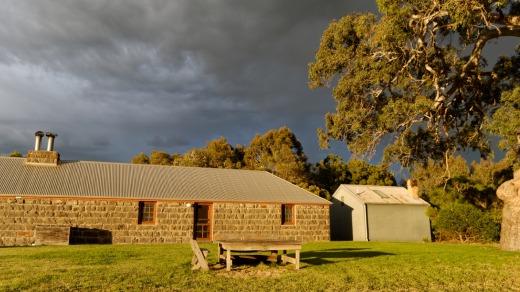 Sunlight falls on the cottages.