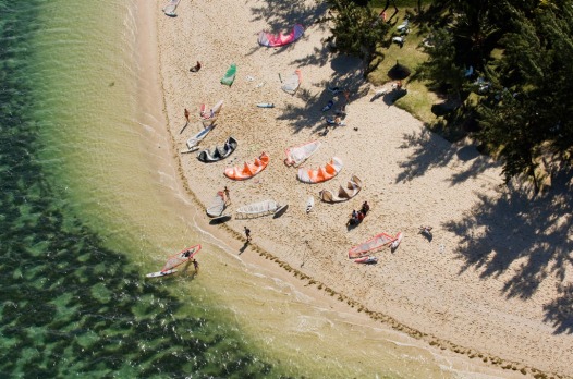 Kitesurfers and surfers on beach, Mauritius travel - Mauritius