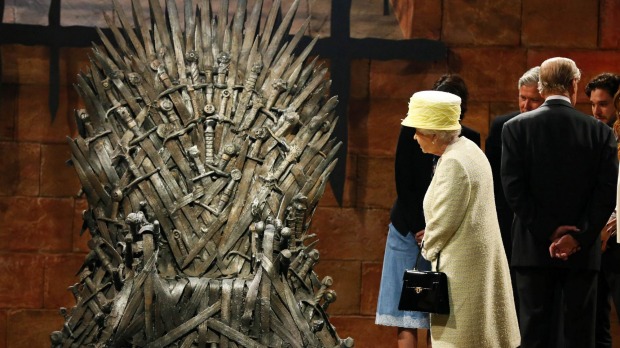 Ireland: Queen Elizabeth looks at the Iron Throne as she meets members of the cast on the set of the television series ...