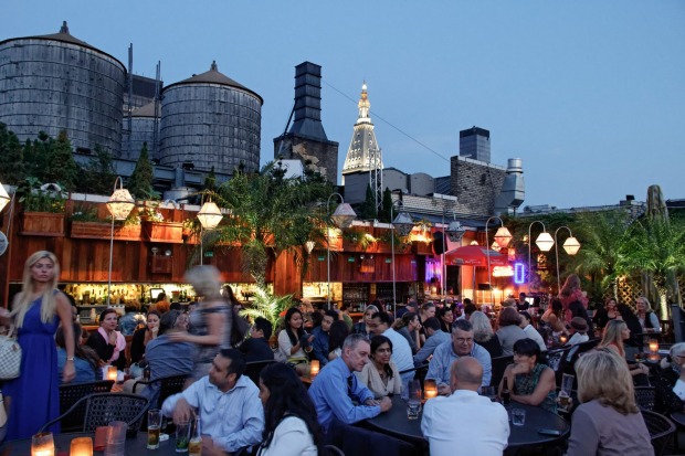 Any excuse for a sunset drink: Rooftop bar 230 Fifth Avenue, Manhattan, New York, USA.