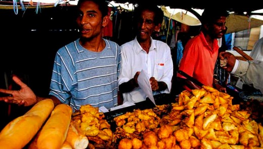 Breadsticks and samosas for sale in the Quatre Bornes market in Plaine Wilhems.