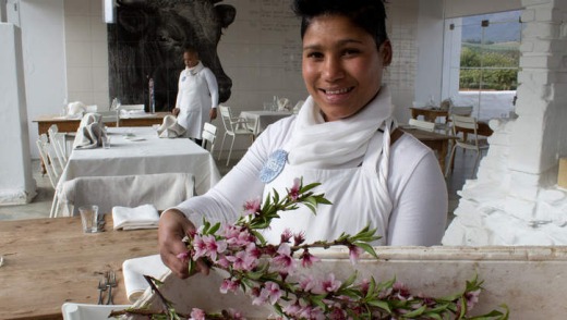 Organic oasis: a waitress brings in fresh blossoms for the tables at Babel Restaurant.