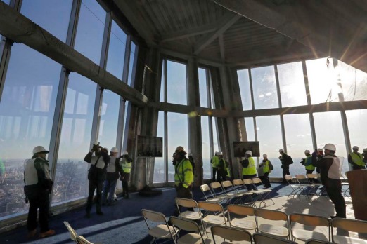 New York Port Authority officials unveil the stunning view from the top of One World Trade Centre, a 360-degree eagle’s ...