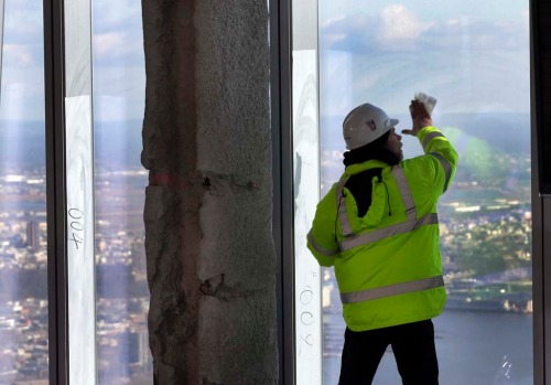 New York Port Authority officials unveil the stunning view from the top of One World Trade Centre, a 360-degree eagle’s ...