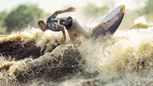 Brazilian Picuruta Salazar surfs a wave on the Amazon River in Amapa in northeastern Brazil in 2003, riding the longest ...