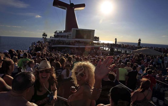 Fans crowd the deck of the Carnival Destiny ahead of Kid Rock's opening performance on the cruise.