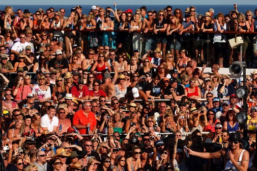 Fans gather on deck during the cruise hosted by musician Kid Rock, bottom right.