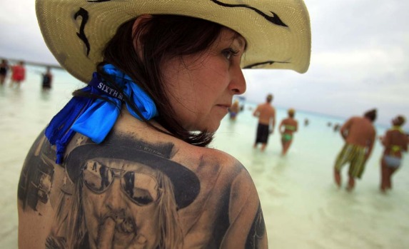 Roxie Decambra shows one of her many Kid Rock tattoos. The Kid Rock cruise  kicks off this year's music cruise season in ...