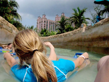Visitors get a ride through rocky tunnels and over rapids on the mile-long Current at the Atlantis Paradise Island ...