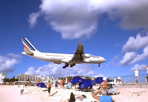 Princess Juliana International Airport, St. Maarten. It regularly welcomes wide-body jetliners like Boeing 747s and ...